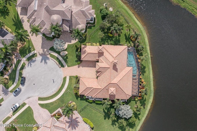 birds eye view of property with a water view