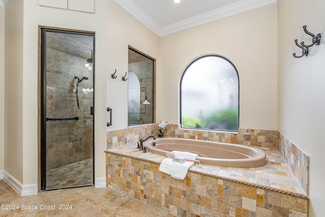 bathroom featuring separate shower and tub and crown molding