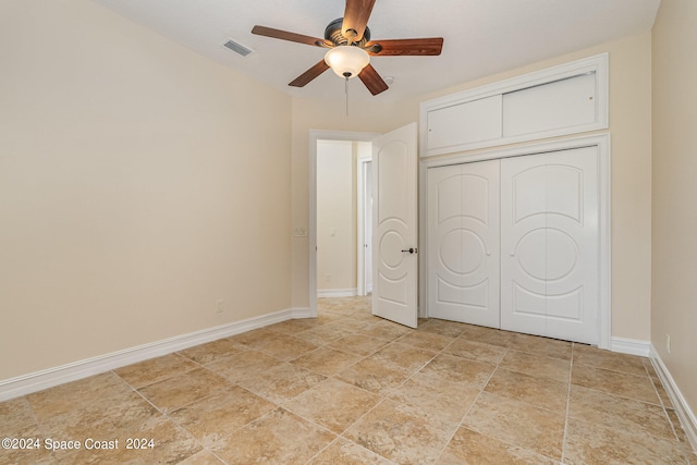 unfurnished bedroom featuring a closet and ceiling fan