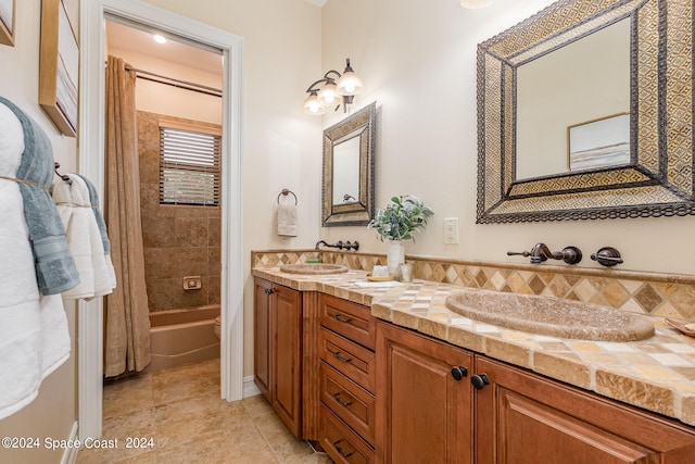 bathroom featuring shower / bathtub combination with curtain and vanity