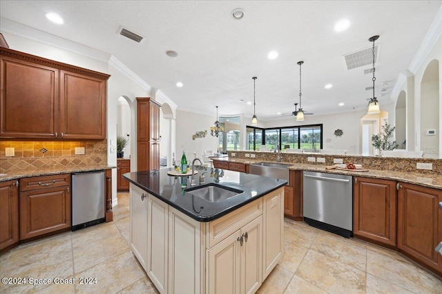 kitchen featuring crown molding, stainless steel dishwasher, sink, and decorative light fixtures