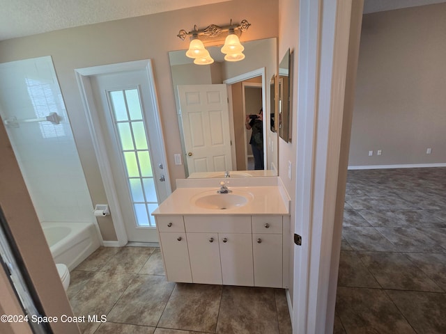 bathroom with vanity, a textured ceiling, tile patterned flooring, and plus walk in shower