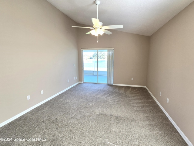 unfurnished room featuring ceiling fan, carpet flooring, and vaulted ceiling