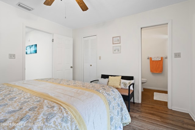 bedroom with a closet, connected bathroom, ceiling fan, and hardwood / wood-style flooring