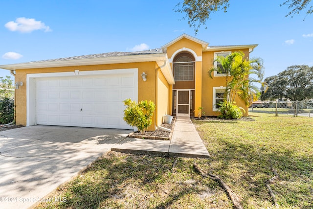 view of front of house with a front lawn and a garage