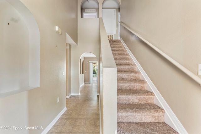 stairs with a towering ceiling