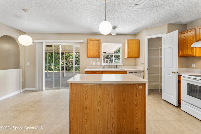 kitchen with white electric range oven, sink, pendant lighting, and a textured ceiling