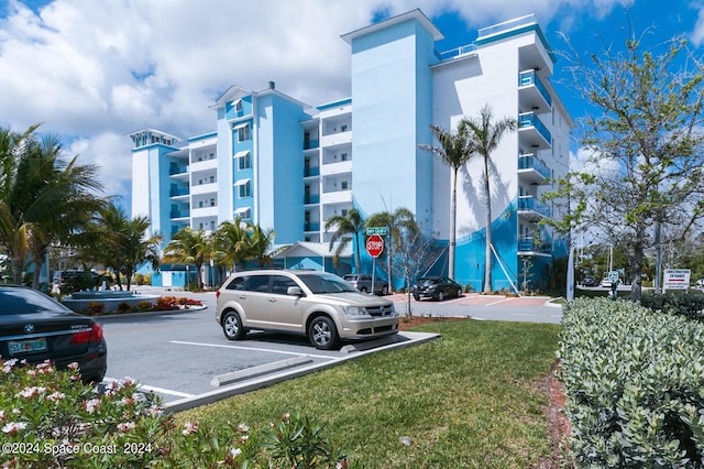 view of property with uncovered parking