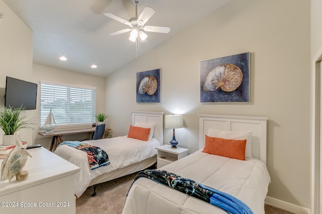 carpeted bedroom featuring lofted ceiling and ceiling fan