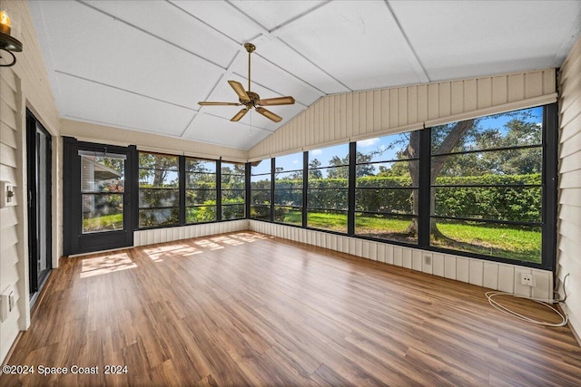 unfurnished sunroom featuring ceiling fan and vaulted ceiling