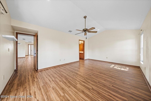 unfurnished living room with wood-type flooring, vaulted ceiling, and ceiling fan