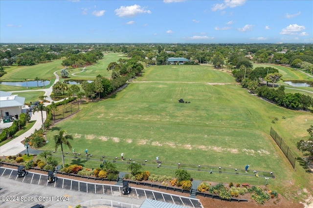 birds eye view of property with a water view and a rural view