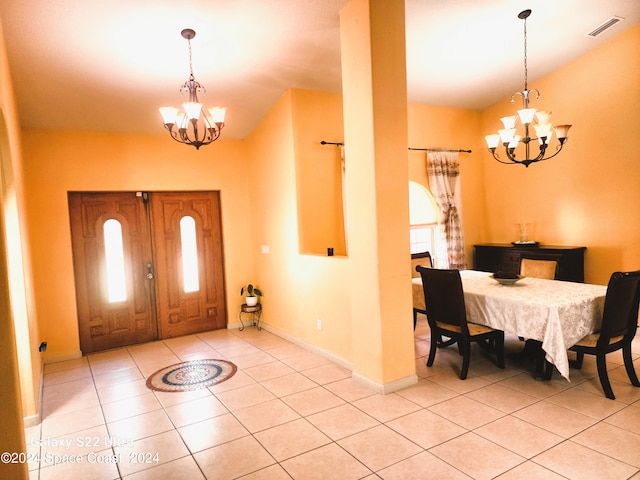 entryway featuring a chandelier and light tile patterned floors