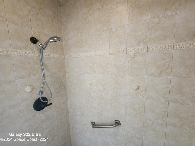 bathroom with tiled shower