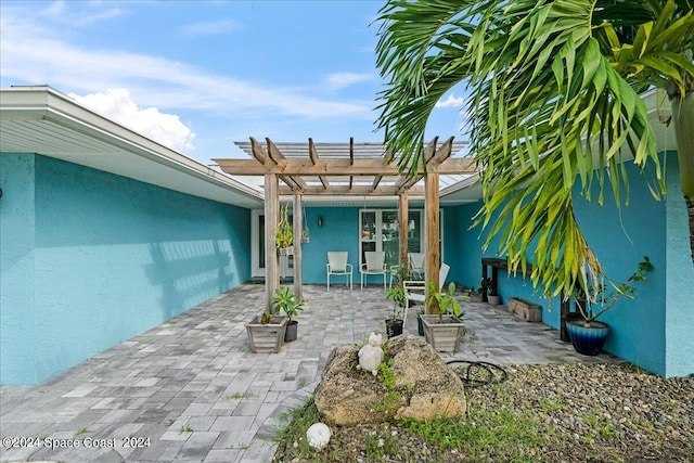 view of patio featuring a pergola