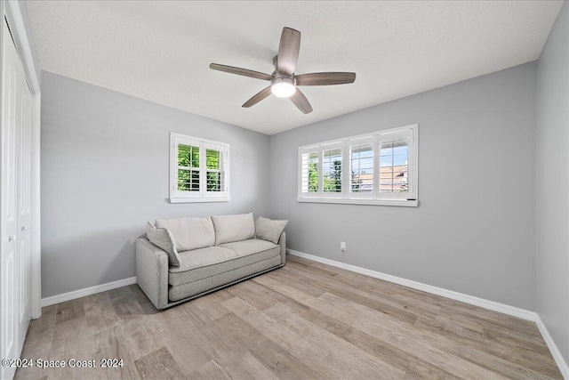 unfurnished room with ceiling fan and light hardwood / wood-style flooring