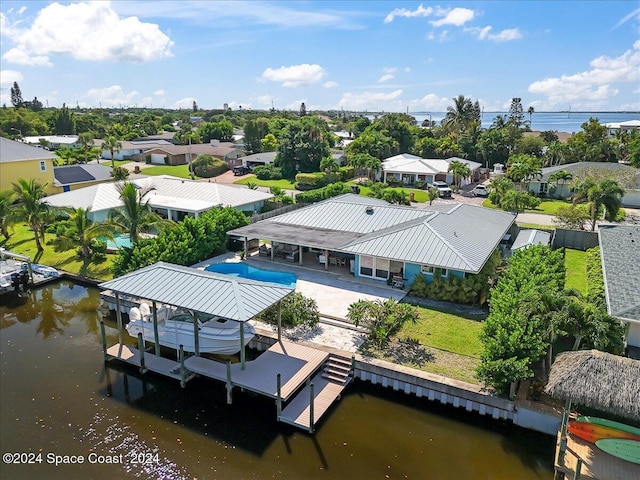 birds eye view of property featuring a water view