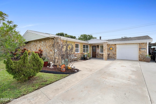 single story home featuring a garage