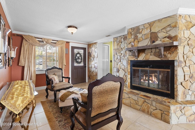 living area with crown molding, light tile patterned flooring, and a stone fireplace