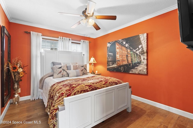 bedroom with ornamental molding, ceiling fan, and hardwood / wood-style floors