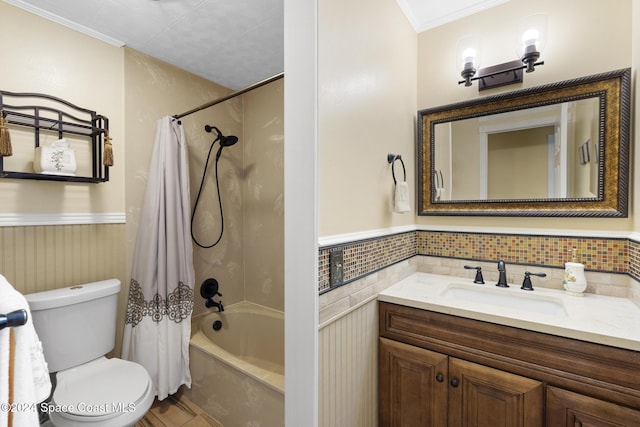 full bathroom featuring vanity, toilet, crown molding, and shower / bath combo