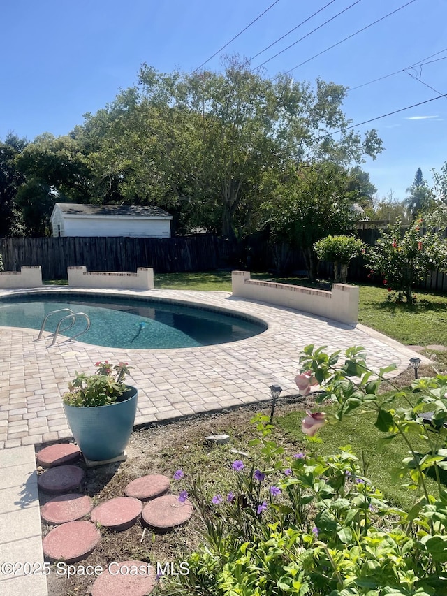 view of swimming pool featuring a patio area