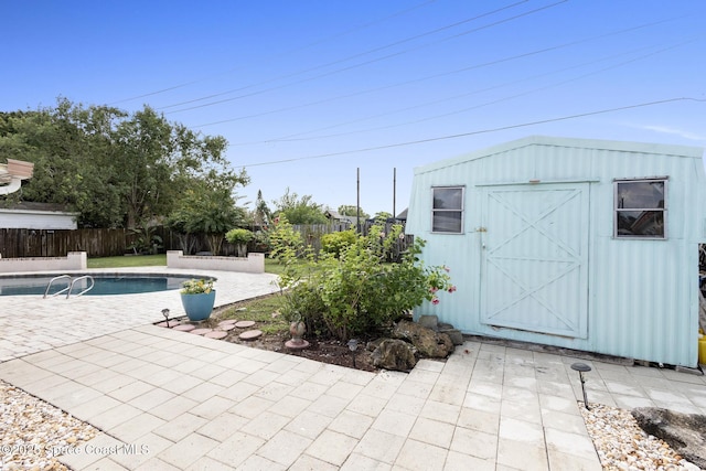 view of outdoor structure with a fenced in pool