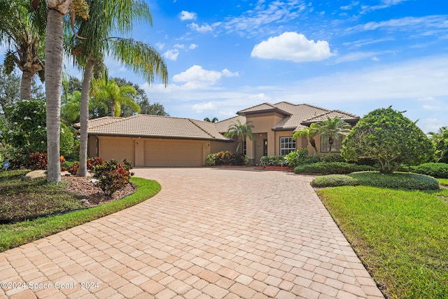 view of front of property with a garage