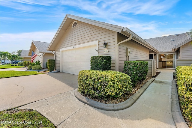 view of property exterior featuring a garage