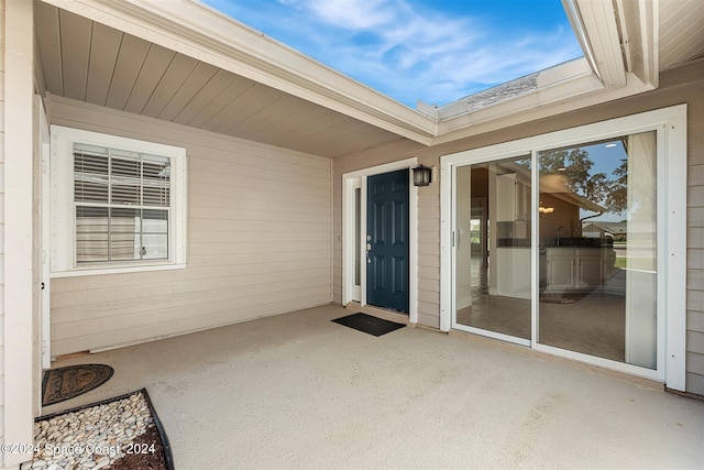 property entrance with a patio