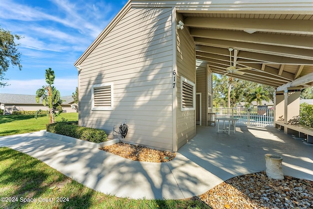 view of side of home with a patio area