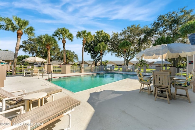 view of swimming pool with a patio area