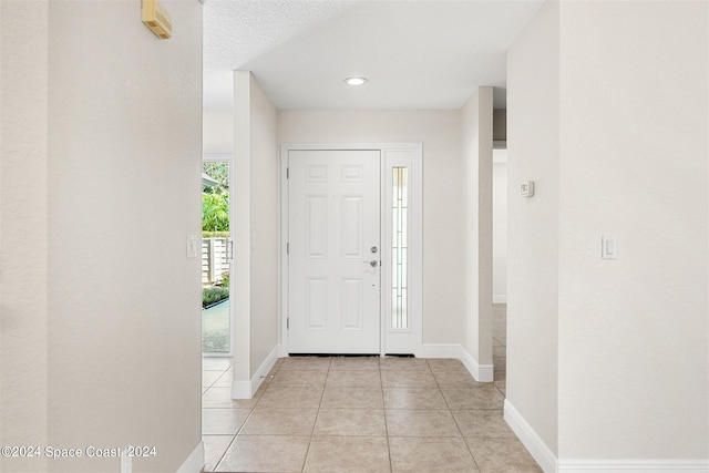 entryway featuring light tile patterned flooring