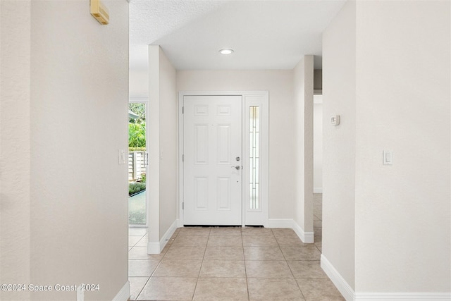 618 Mimosa Ct, Melbourne, FL 32940 - foyer featuring baseboards and light tile patterned flooring