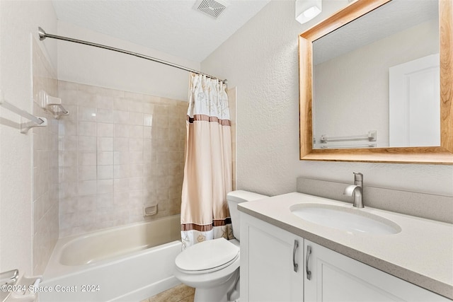 full bathroom featuring vanity, shower / bathtub combination with curtain, a textured ceiling, and toilet