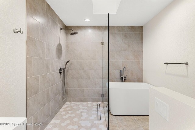 618 Mimosa Ct, Melbourne, FL 32940 - full bath with a freestanding bath, tiled shower, and tile patterned floors