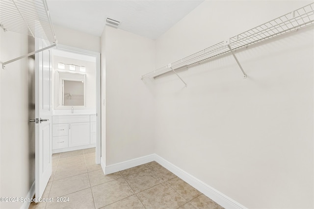 618 Mimosa Ct, Melbourne, FL 32940 - spacious closet featuring visible vents and light tile patterned flooring