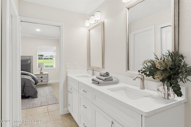 618 Mimosa Ct, Melbourne, FL 32940 - full bathroom featuring double vanity, a sink, tile patterned flooring, and connected bathroom