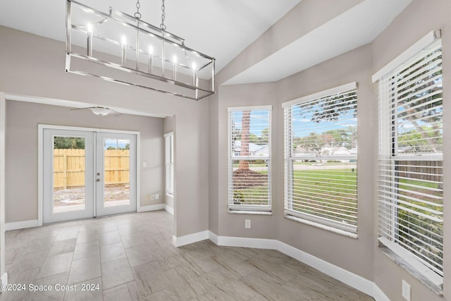 empty room with a healthy amount of sunlight and french doors