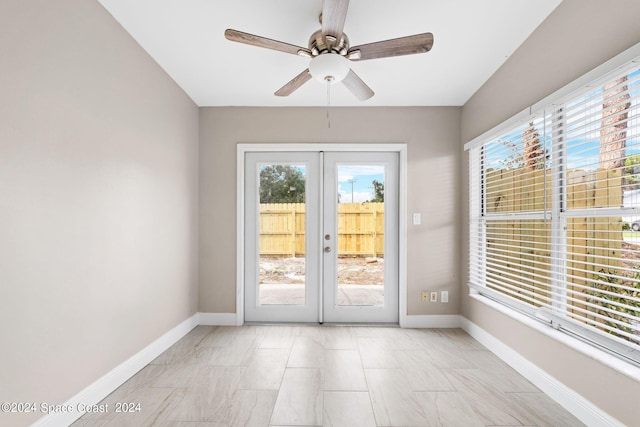 doorway featuring french doors, plenty of natural light, and ceiling fan