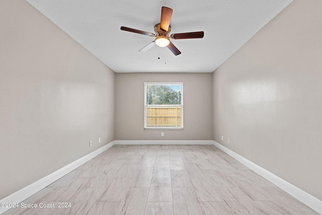 empty room featuring ceiling fan