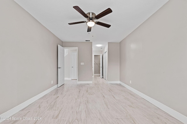 spare room with ceiling fan