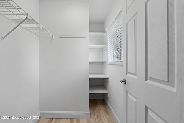 walk in closet featuring light wood-type flooring