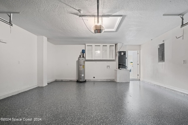 garage with heating unit, water heater, and electric panel