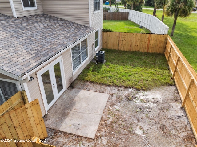 view of yard featuring a patio area and central AC