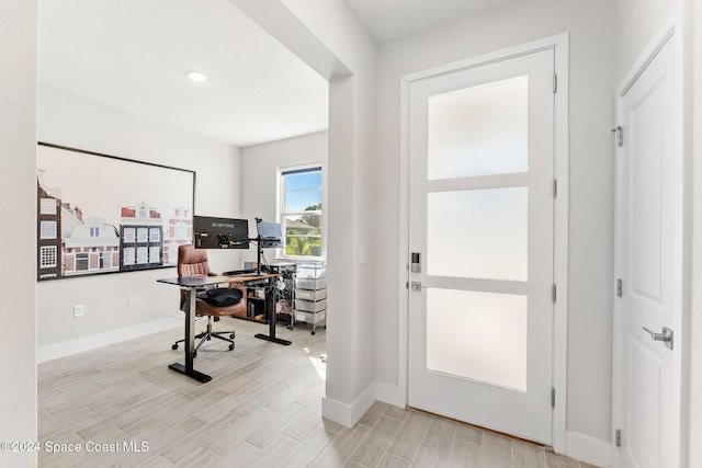 office with light hardwood / wood-style floors