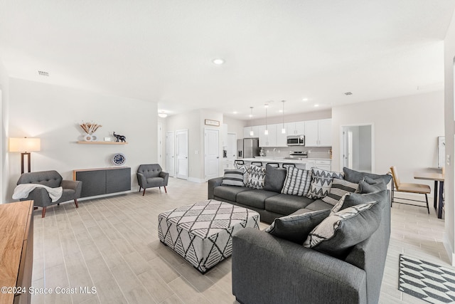 living room with light hardwood / wood-style floors