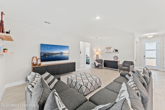 living room with light hardwood / wood-style flooring