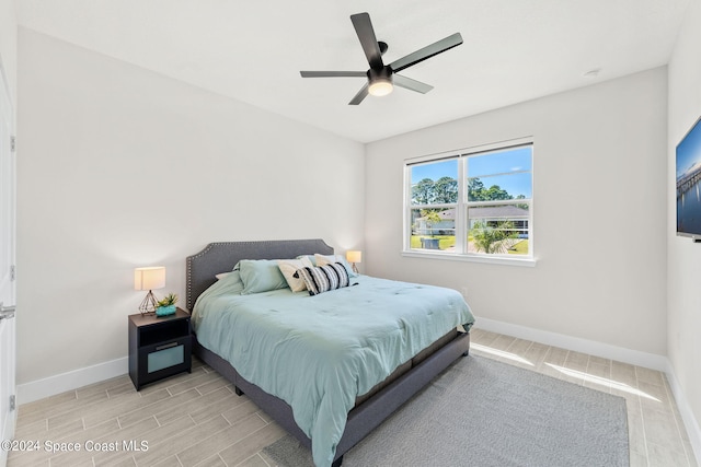 bedroom featuring light hardwood / wood-style floors and ceiling fan