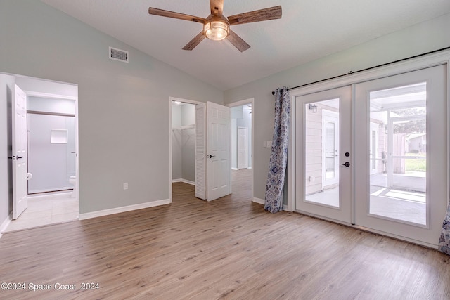 interior space featuring vaulted ceiling, ceiling fan, french doors, and light hardwood / wood-style floors